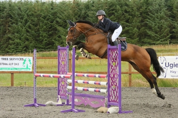 Brenna Miller claims first place in the Equissage Pulse Senior British Novice Second Round at Cabin Equestrian Riding Club.